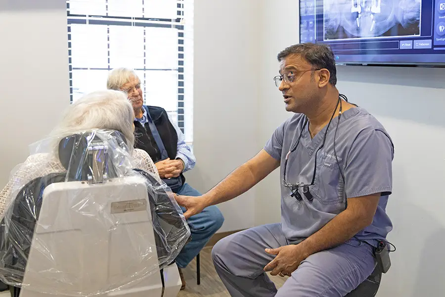 Dr. Adatrow dental implant consultation patient reviewing a 3D scan Southaven, MS
