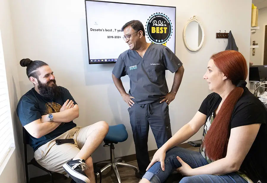 happy dental implant patient post consultation confident smile dr adatrow memphis tn