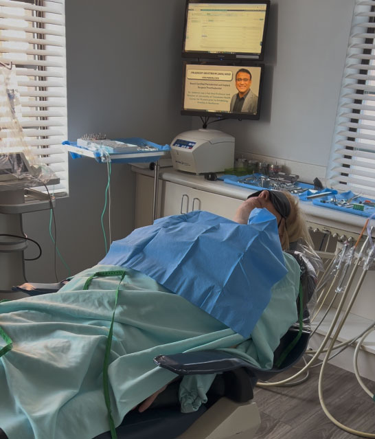 iv sedation dental implant patient resting comfortably during procedure memphis tn